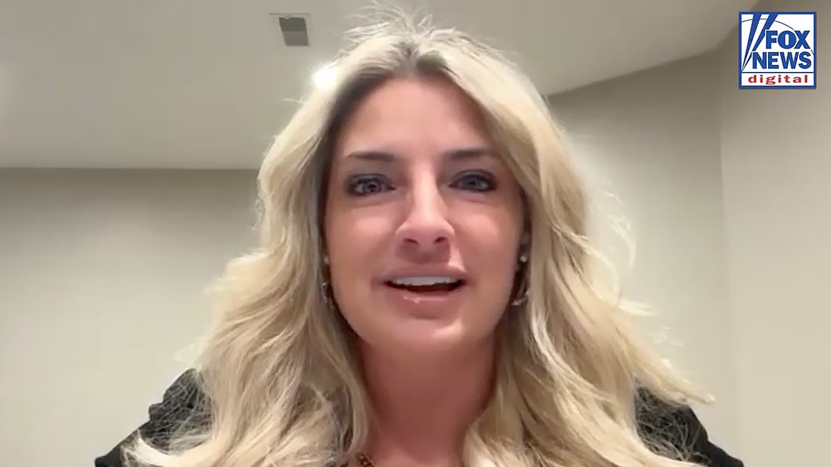 A woman with blonde hair in a Zoom video