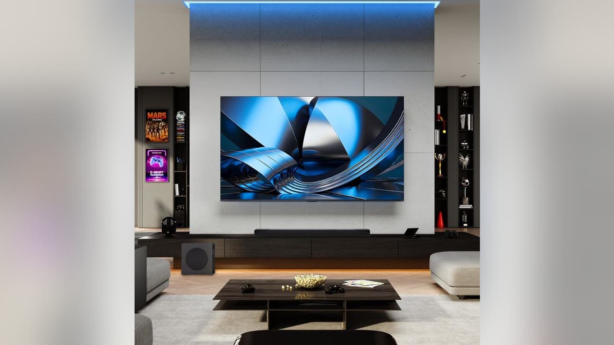 A large 75-inch screen shows the game in crystal-clear color.