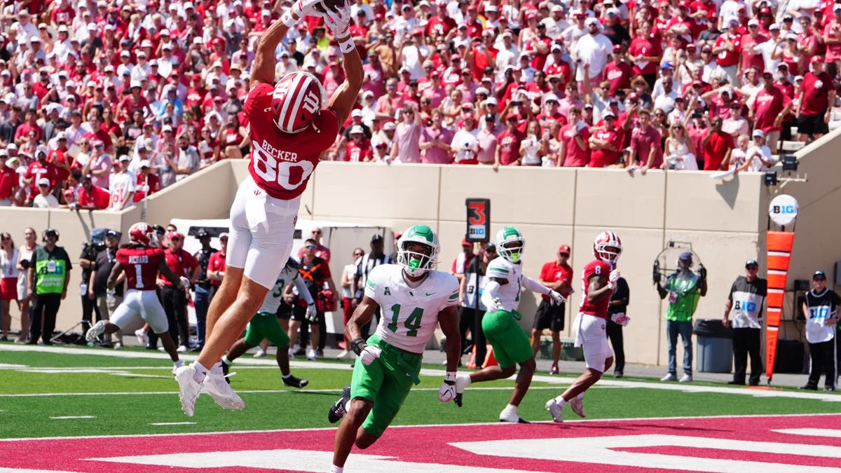 Charlie Becker catches a pass for a touchdown at Memorial Stadium.