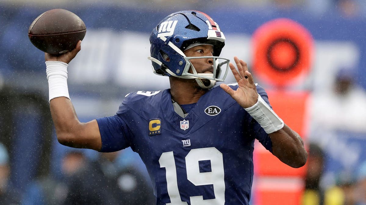 Jameis Winston looks to throw a pass during an NFL game in East Rutherford, N.J.