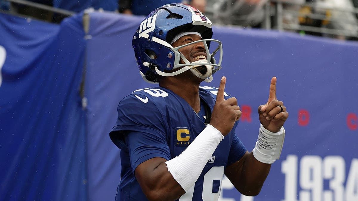 Jameis Winston runs onto the field before an NFL game against the Tennessee Titans in East Rutherford, N.J.