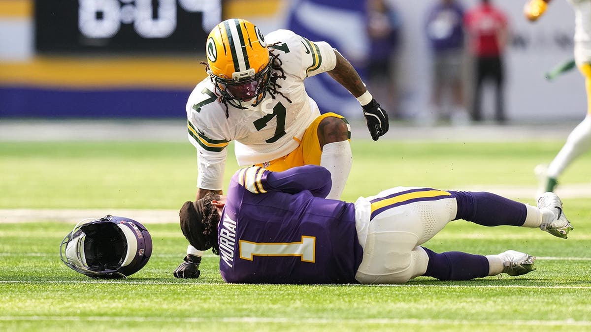 Javon Bullard reacts after tackling Kyler Murray during a game in Minneapolis.