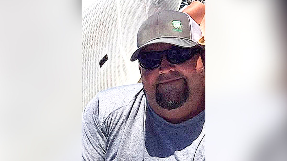 jeffrey pribble wearing sunglasses and cap smiling