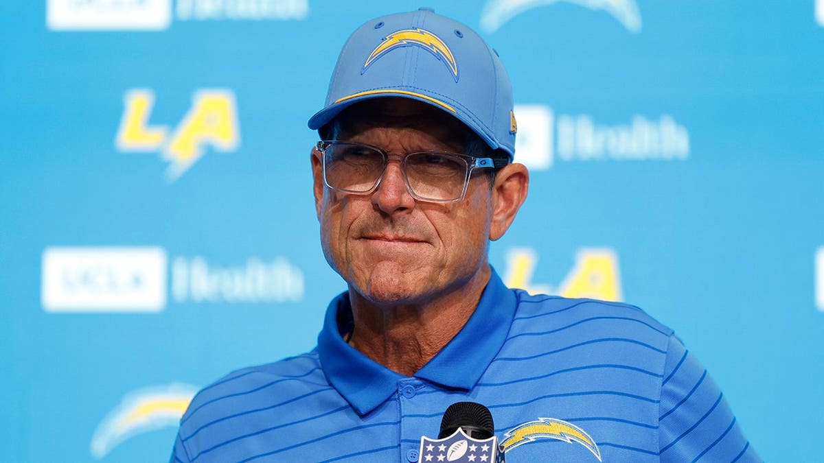 Jim Harbaugh speaks during a news conference in Inglewood, Calif.