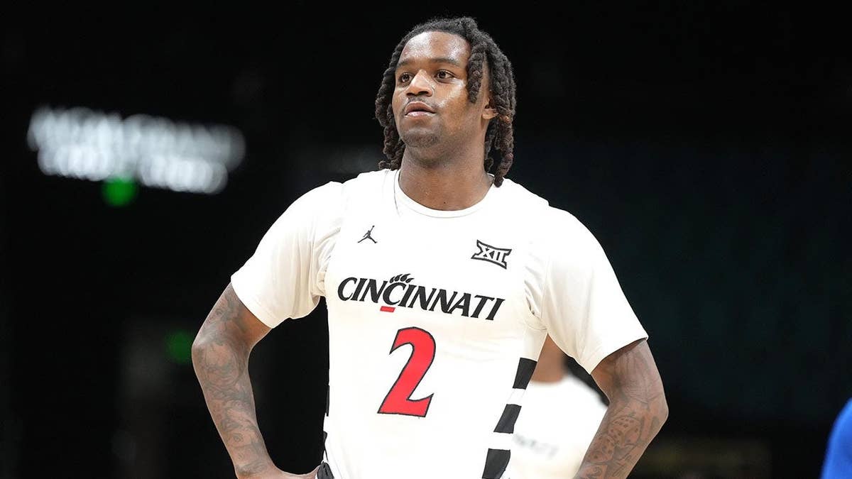 Jizzle James looking on during a college basketball game
