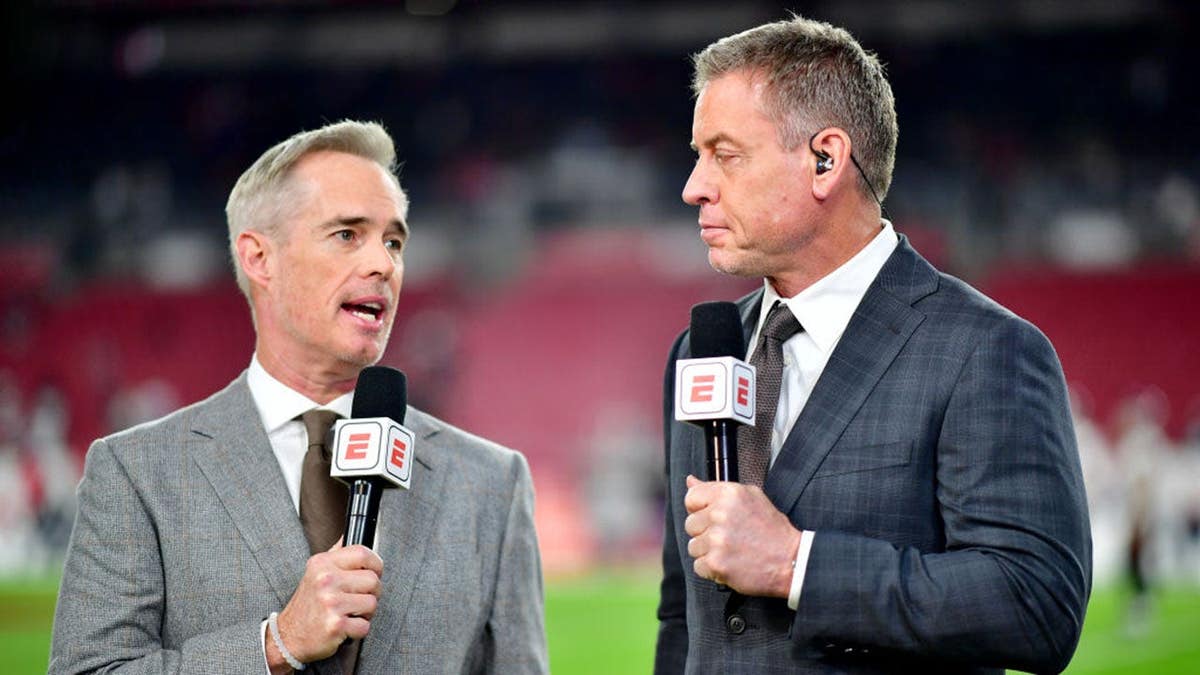 Joe Buck and Troy Aikman look on at Raymond James Stadium in Tampa.