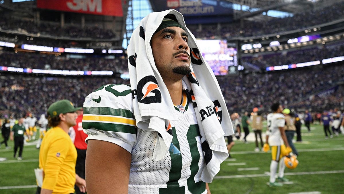 Jordan Love looks on after a game at U.S. Bank Stadium.