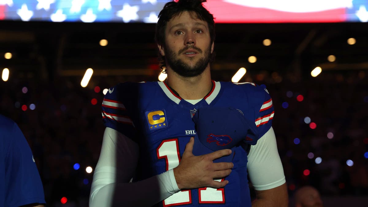 Josh Allen stands for the national anthem at Highmark Stadium.