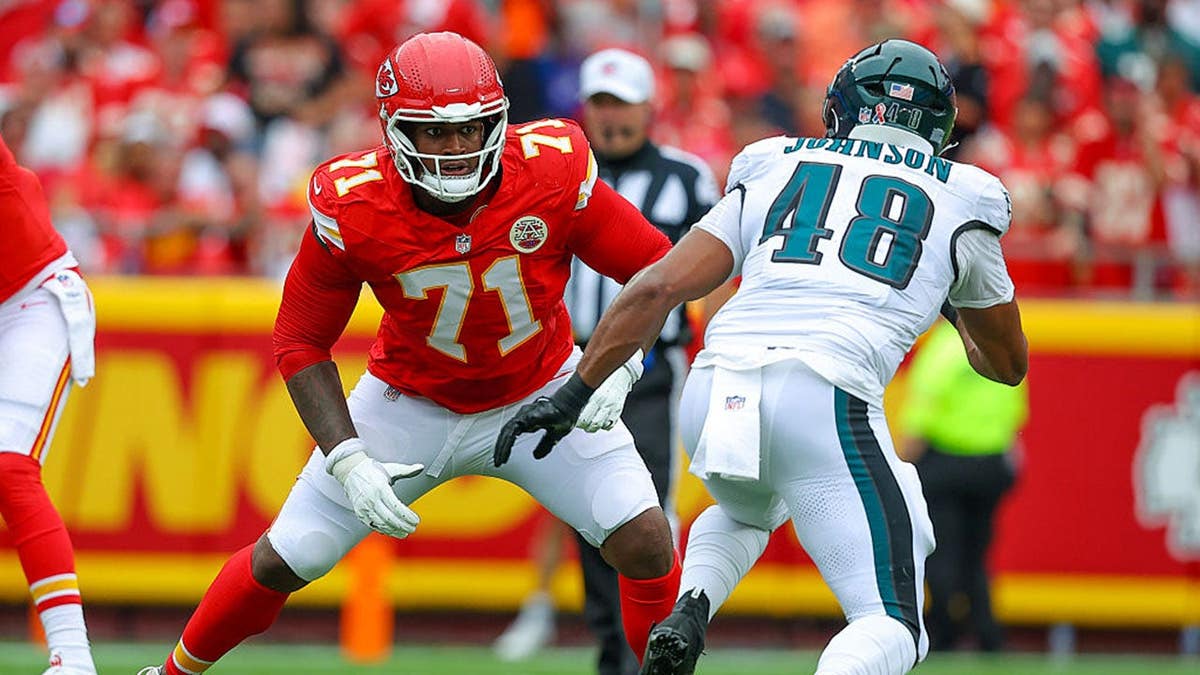 Josh Simmons of the Kansas City Chiefs prepares to block Patrick Johnson of the Philadelphia Eagles.