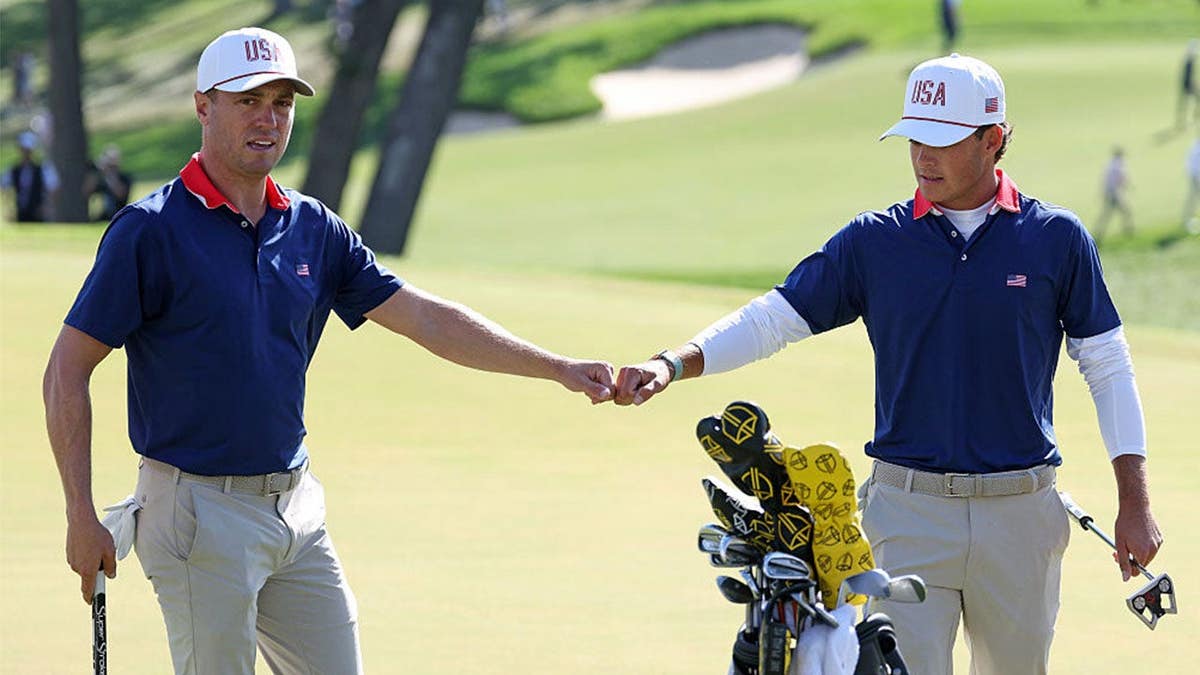 Justin Thomas of the U.S. Team reacts with Jackson Koivun