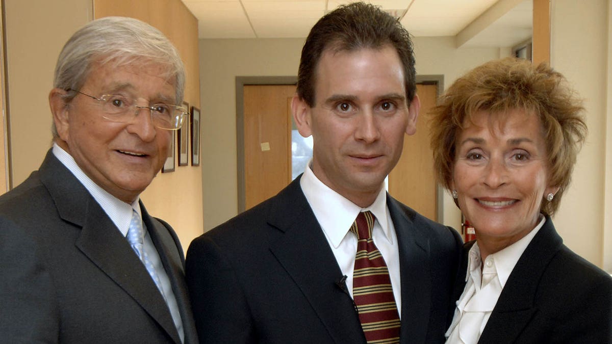 Judge Judy with her husband and son Adam Levy 