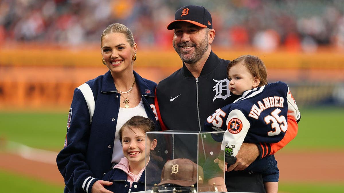 Justin Verlander poses with his wife Kate Upton and their children at Comerica Park.