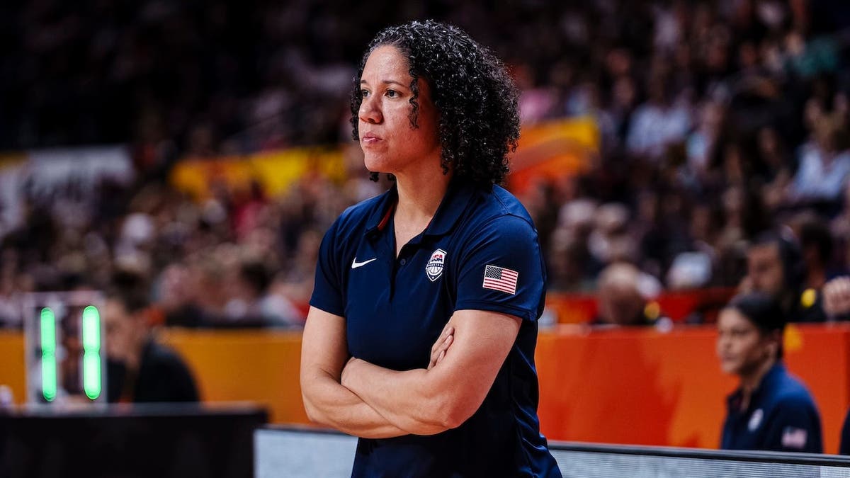 Kara Lawson, United States head coach, looks on during a basketball game. Kara Lawson, United States head coach, looks on during a basketball game.