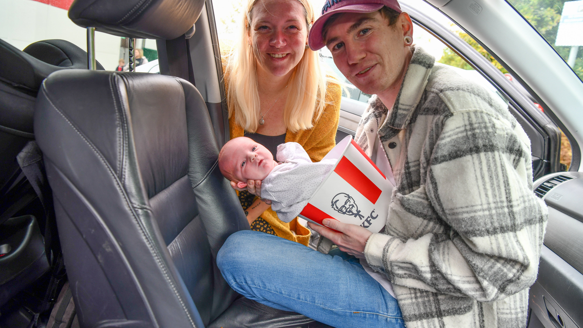 Katie Murphy and Stephen Kirby hold their newborn son Cody in a car at KFC Bromsgrove parking lot