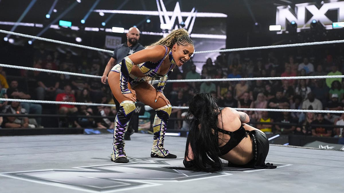 Kelani Jordan looks over Tatum Paxley during NXT at the WWE Performance Center.
