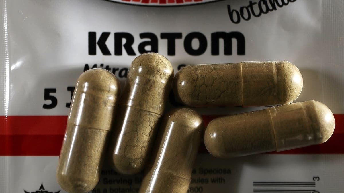 Kratom pills on a surface.