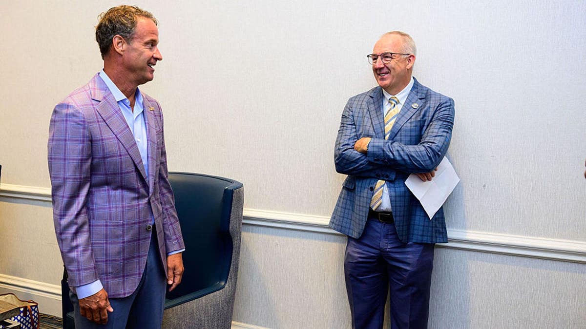Lane Kiffin talks to Greg Sankey at SEC Media Day.