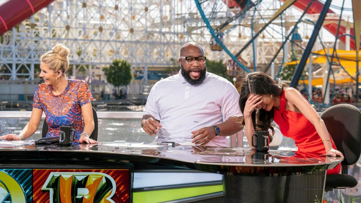 Laura Rutledge, Keyshawn Johnson and Mina Kimes laugh during an ESPN broadcast.