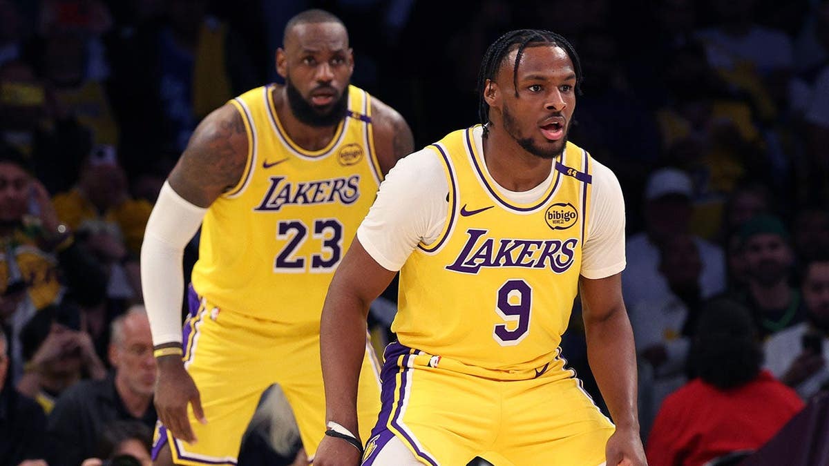 LeBron James and Bronny James defend during a Lakers game at Crypto.com Arena.