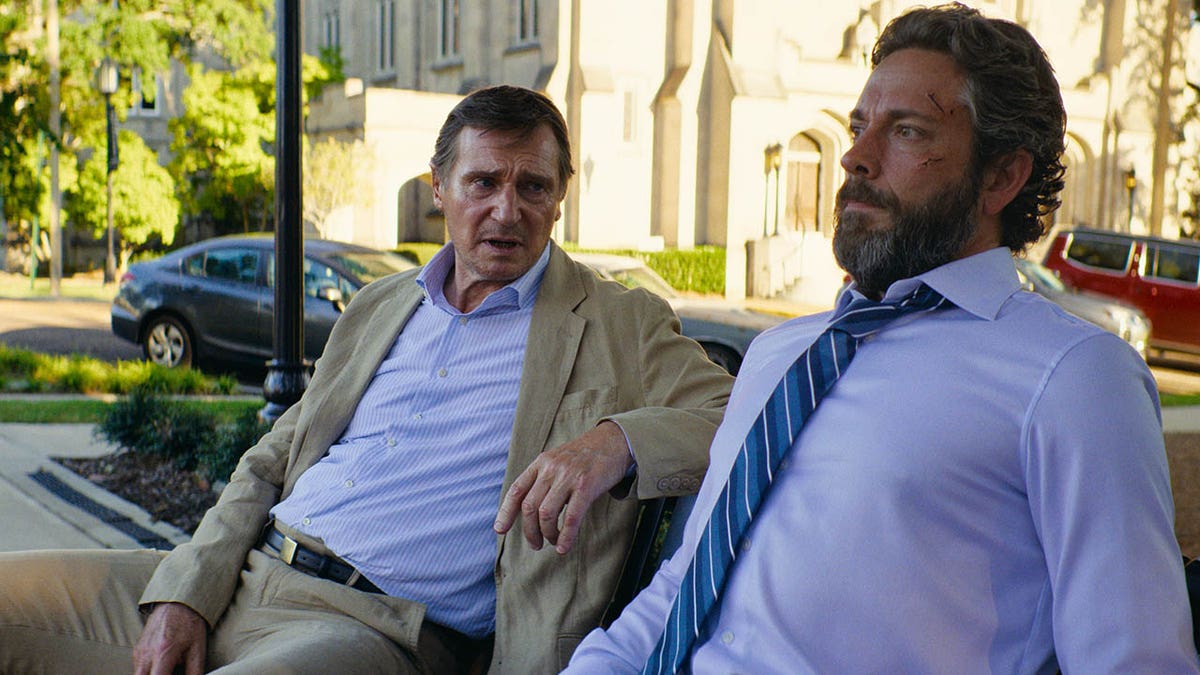 Liam Neeson talking to Zachary Levi in The Fix 