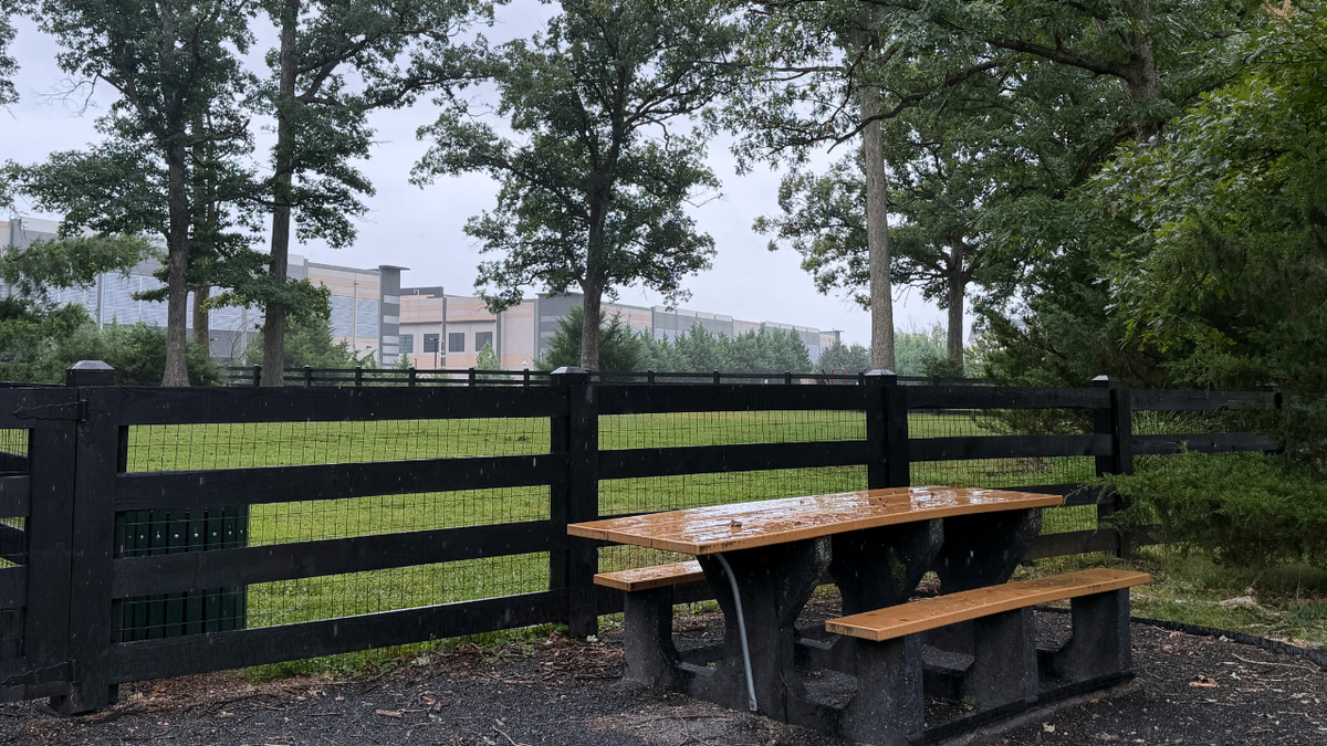 A neighborhood picnic table sits just yards from a data center in Loudoun County, Virginia, on Sept. 21, 2026.