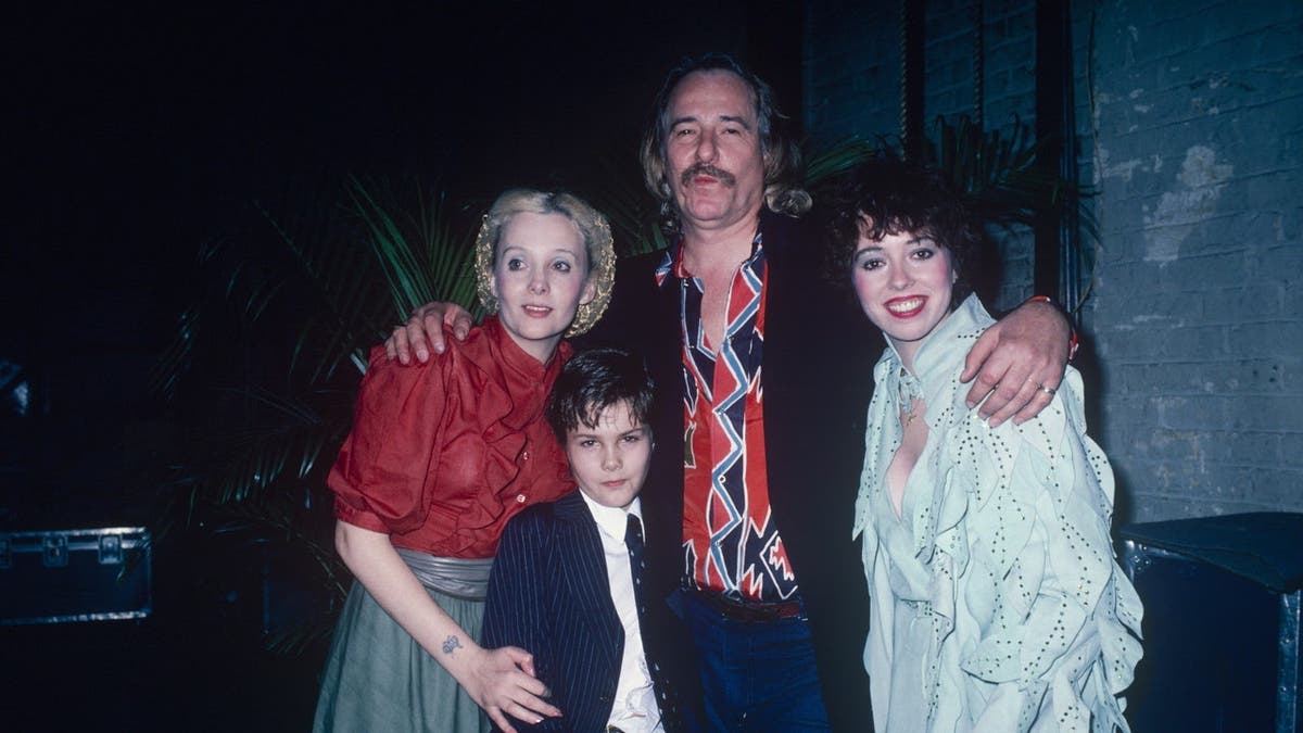Mackenzie Phillips stands with her father John Phillips, half-brother Tamerlane, and Genevieve Waite.