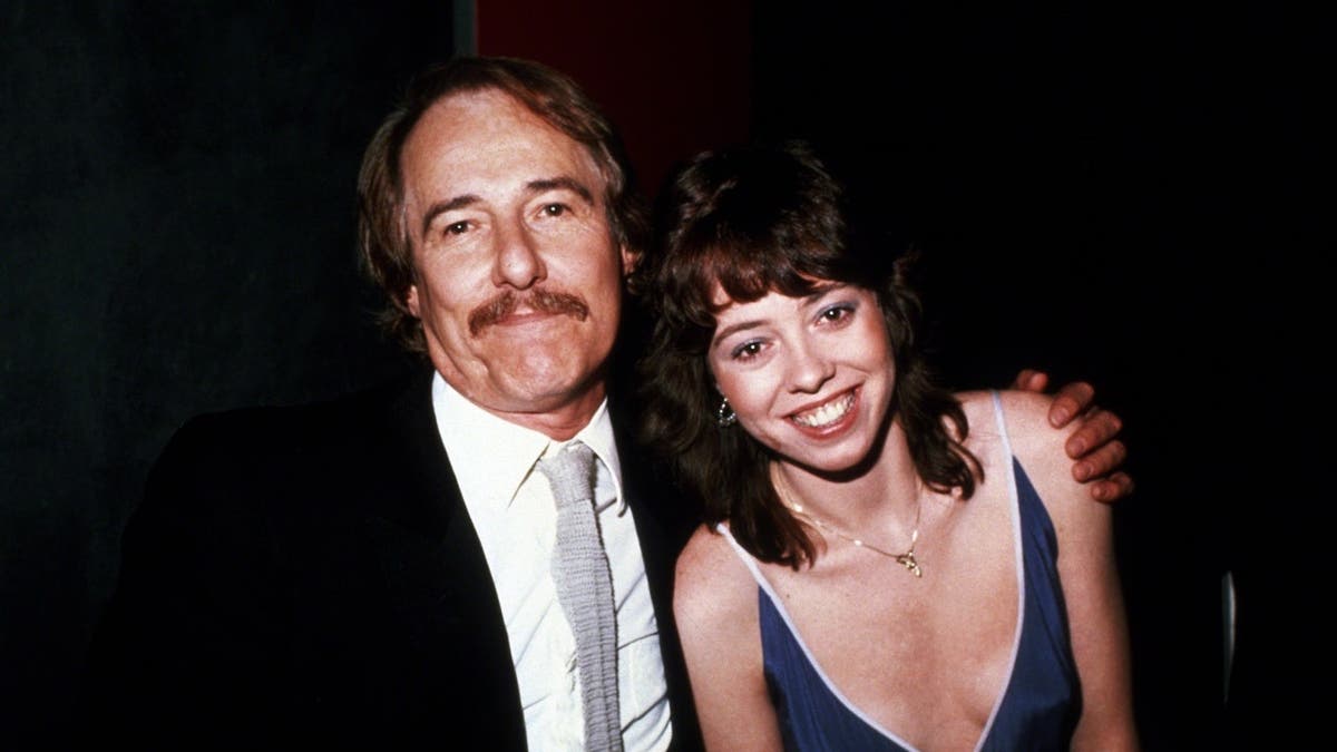 Mackenzie Phillips stands with her father, John Phillips, in New York City.