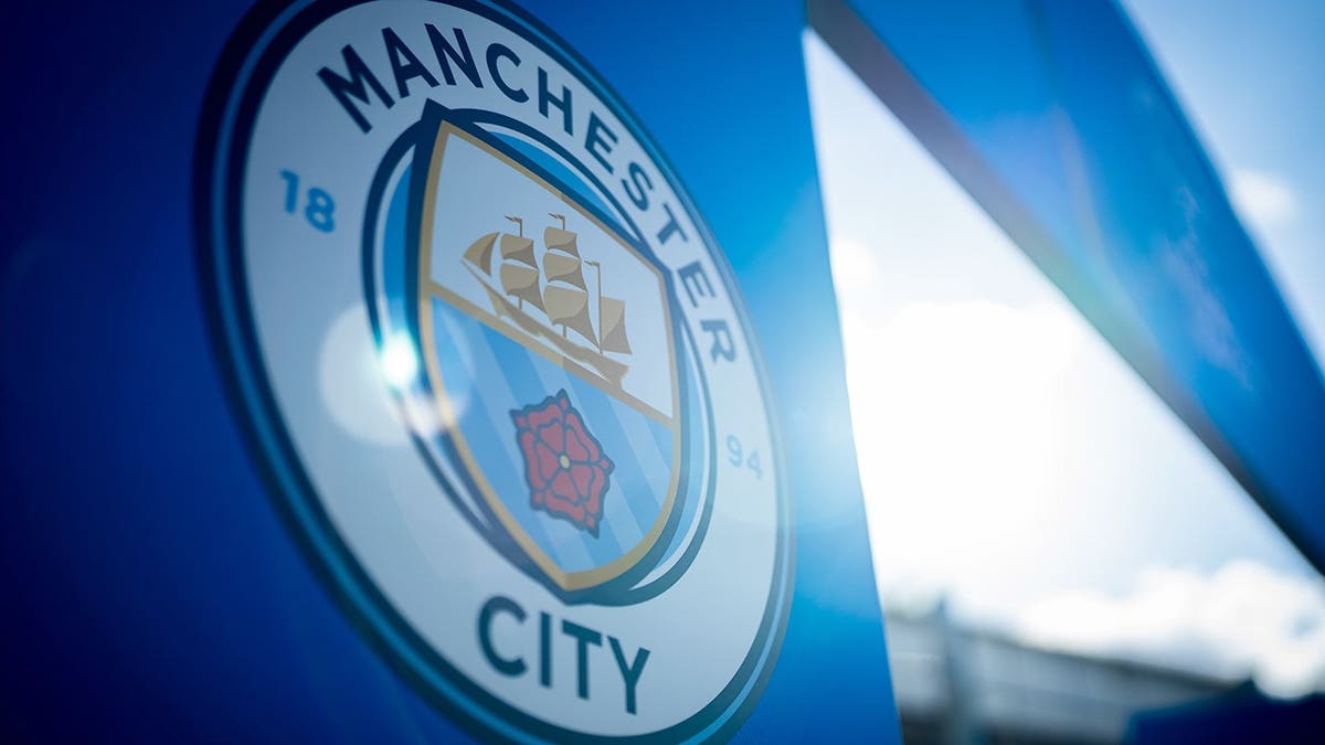 Manchester City logo displayed at the players tunnel entrance before a UEFA Women's Champions League match.