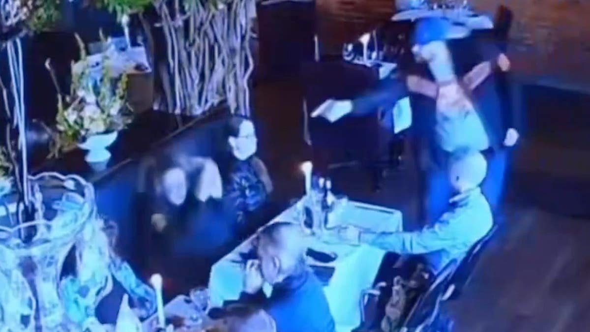 Matthew Exton points a gun at the head of his ex-wife