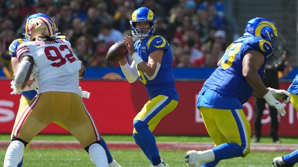 Matthew Stafford, Los Angeles Rams quarterback, drops back to pass against the San Francisco 49ers.