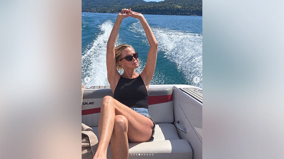 Melanie Griffith on a boat on a lake.