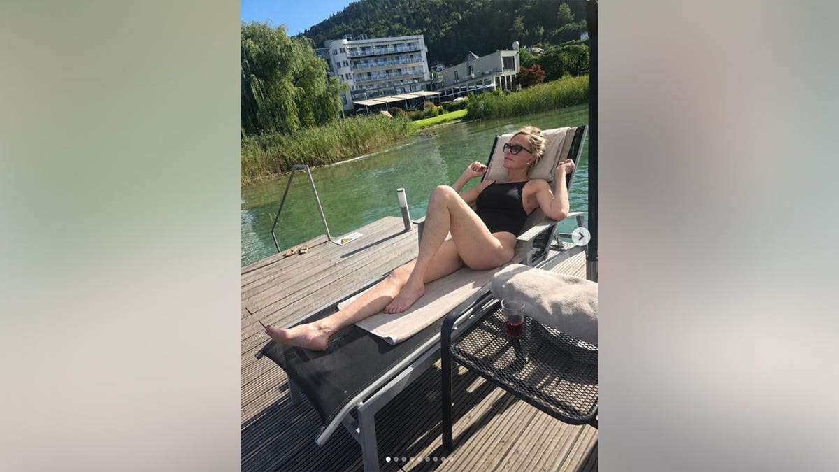 Melanie Griffith in a black swimsuit while in Austria.
