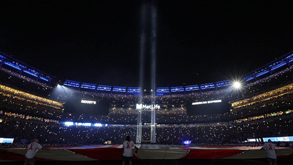 Tribute in Light shines on the field at MetLife Stadium.