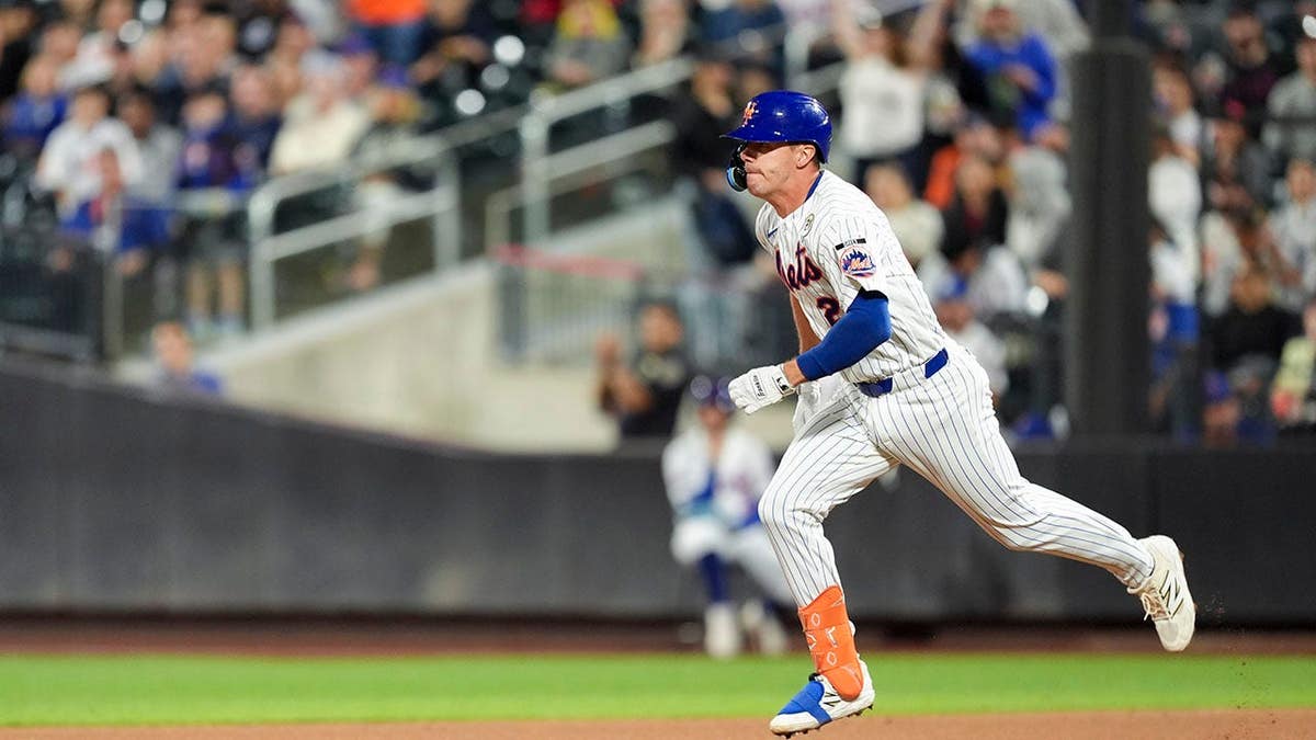Jared Young runs to second base after hitting a double at Citi Field.