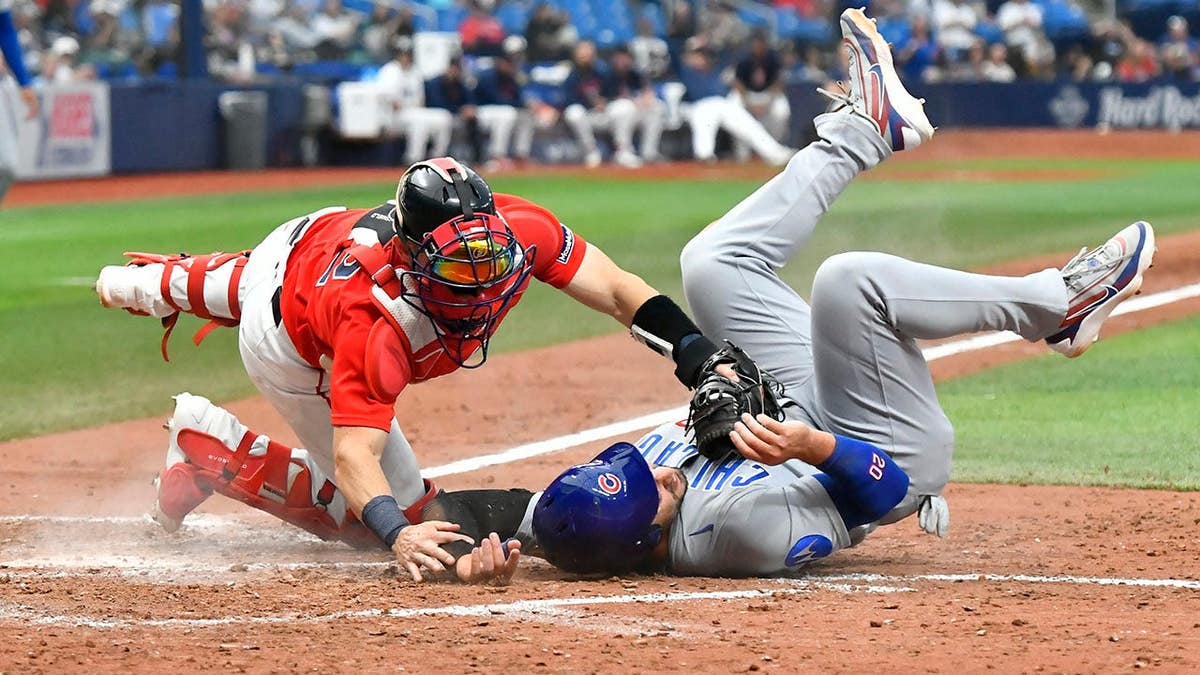 Michael Conforto is out at home plate during a play at Tropicana Field.