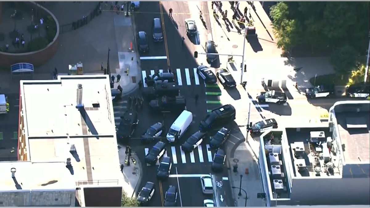 Law enforcement react to the scene of shooting in Minneapolis, Wednesday, Sept. 2, 2036.
