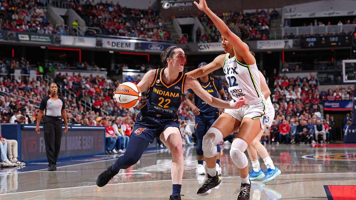 Myisha Hines-Allen handles the ball during a WNBA game in Indianapolis.