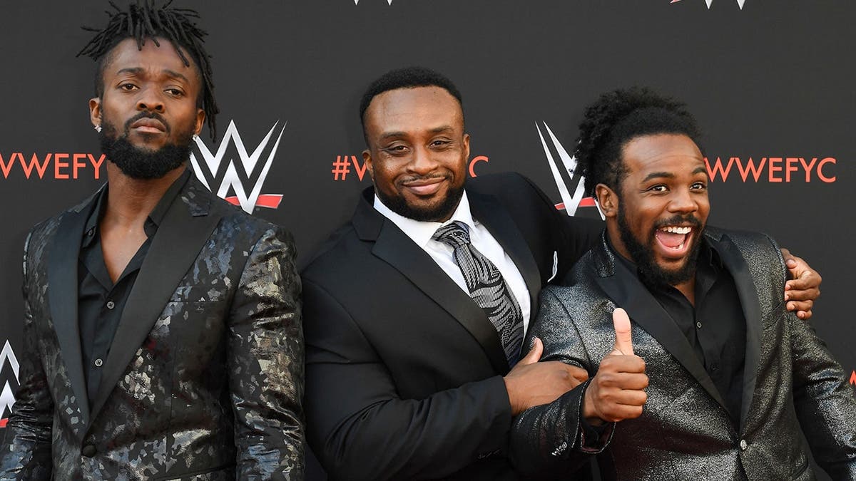 Kofi Kingston, Big E and Xavier Woods of The New Day arrive at an event.