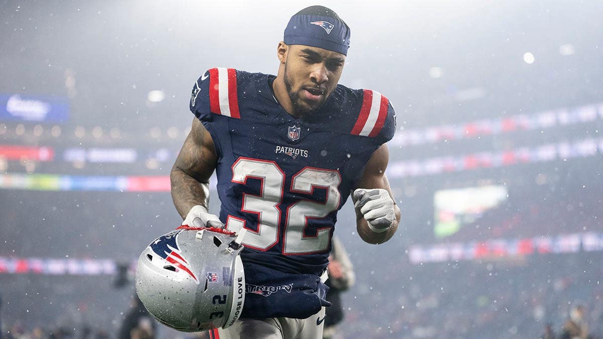 TreVeyon Henderson runs off the field at Gillette Stadium.