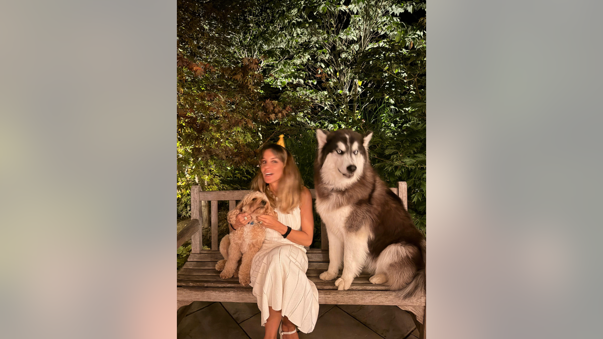 Alejandra Silva-Gere with their family dogs.