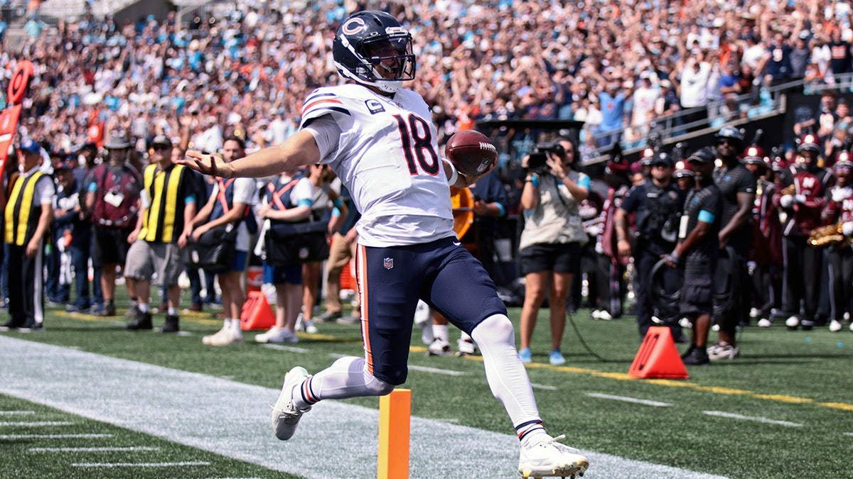 Caleb Williams runs for a TD