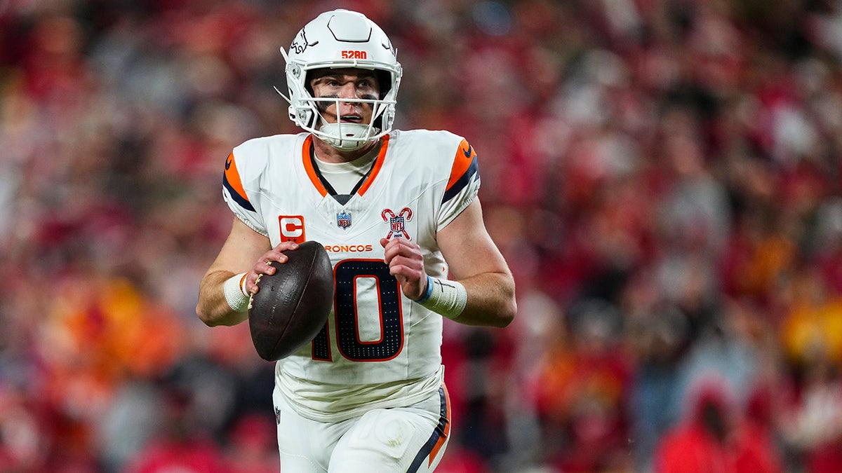 Bo Nix looks down field