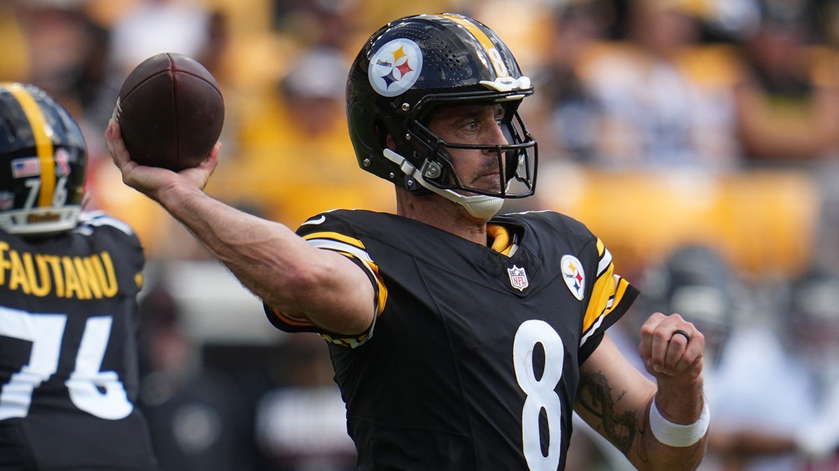 Aaron Rodgers looks to pass