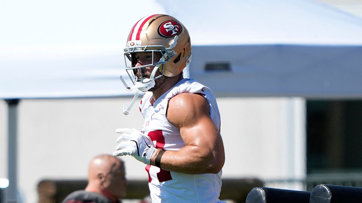 Nick Bosa, wearing number 97, works out during San Francisco 49ers training camp practice.