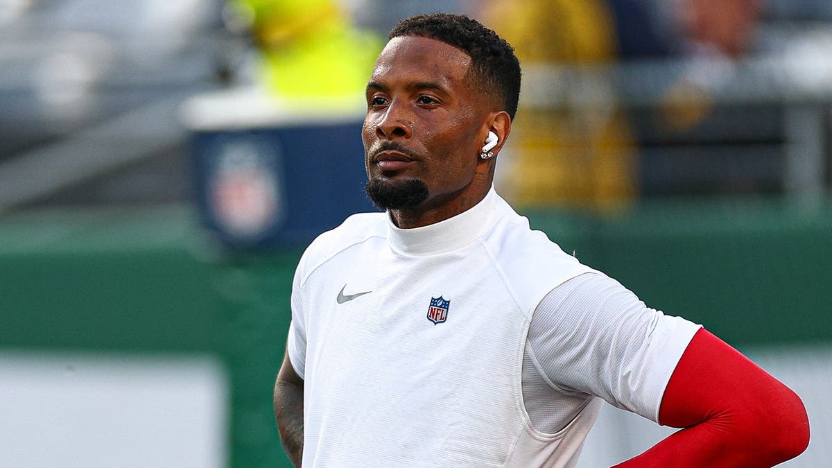 Odell Beckham Jr. stands on the field during warmups before the Giants-Jets game.