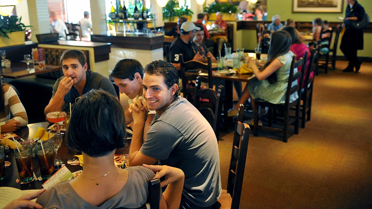 Customers dine at an Olive Garden restaurant.