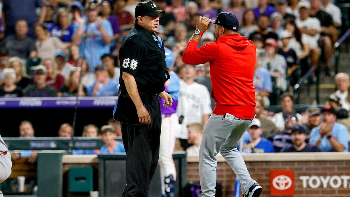 St. Louis Cardinals manager Oliver Marmol argues with home plate umpire Doug Eddings during a game at Coors Field.