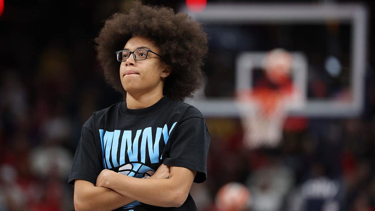 Olivia Miles, Minnesota Lynx player number 5, stands on the sideline.