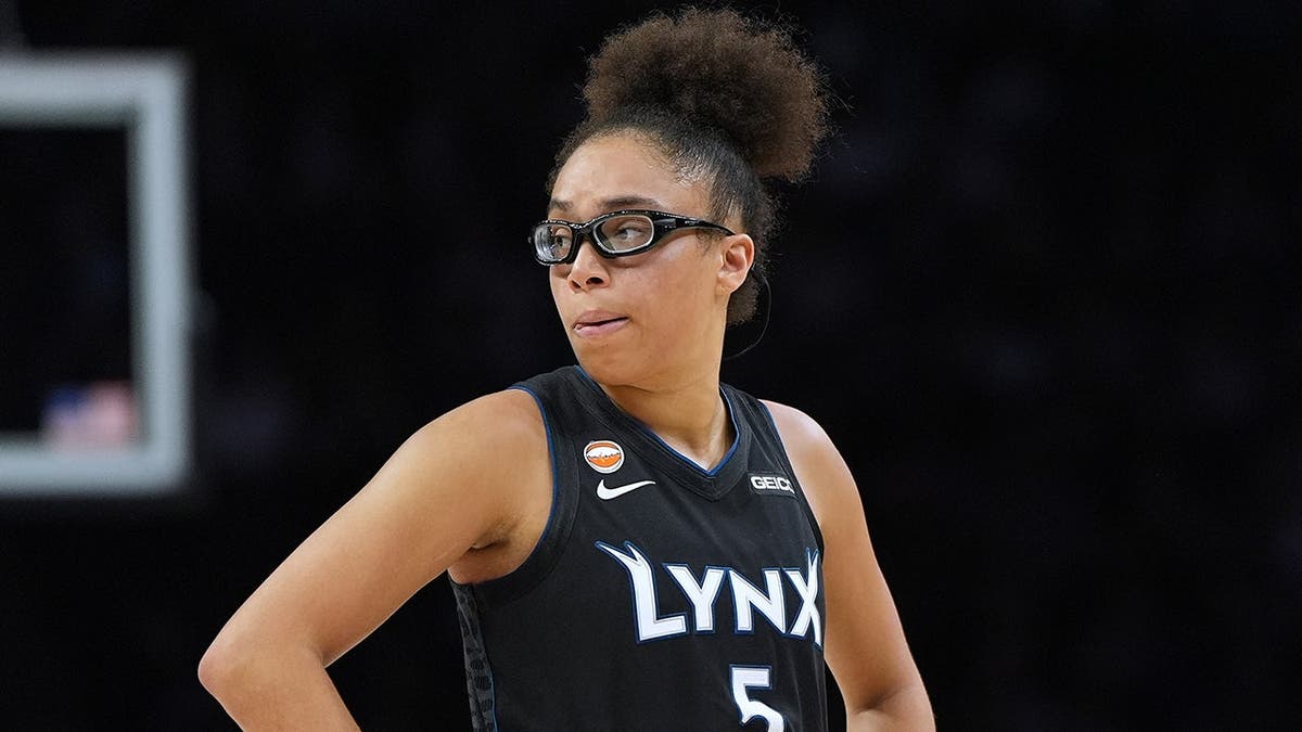 Olivia Miles stands on the court during a WNBA basketball game.