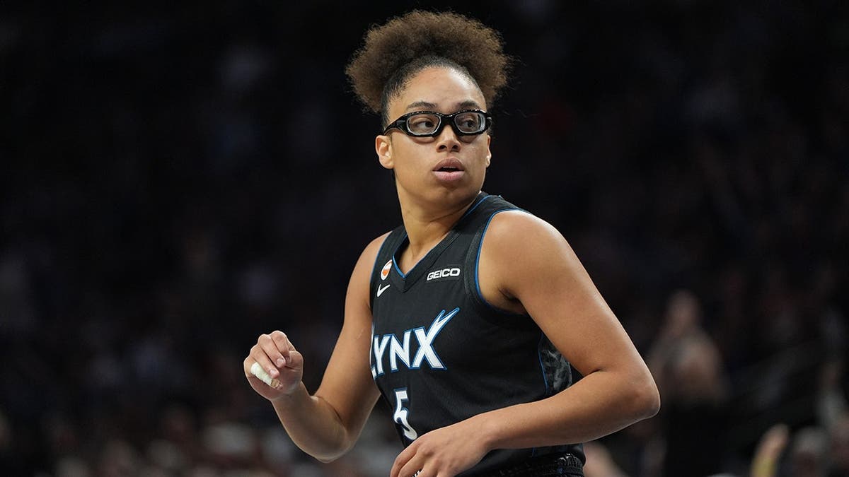 Olivia Miles jogs across the court during a WNBA basketball game.